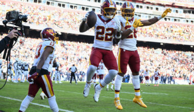 Washington Commanders running back Jacory Croskey-Merritt (22) is congratulated by teammates running back Jeremy McNichols and wide receiver Treylon Burks (13) after scoring during the first half an NFL football game against the Dallas Cowboys Thursday, Dec. 25, 2025, in Landover, Md. (AP Photo/Nick Wass)