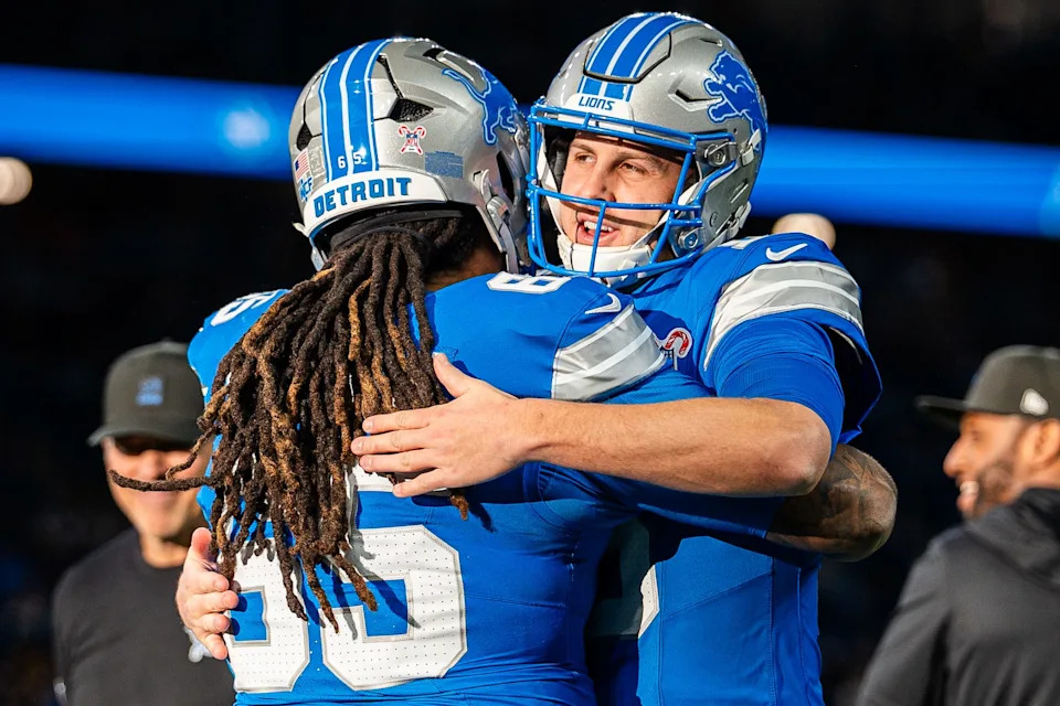 Detroit Lions quarterback Jared Goff hugs center Kingsley Eguakun before a game against the Pittsburgh Steelers at Ford Field in Detroit on Sunday, Dec. 21, 2025.