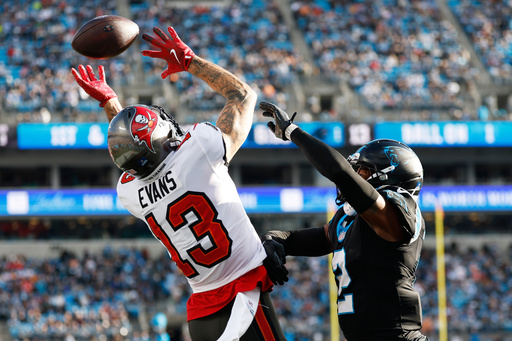 Carolina Panthers safety Lathan Ransom breaks up a pass intended for Tampa Bay Buccaneers wide receiver Mike Evans during the second half of an NFL football game, Sunday, Dec. 21, 2025, in Charlotte, N.C. (AP Photo/Rusty Jones)