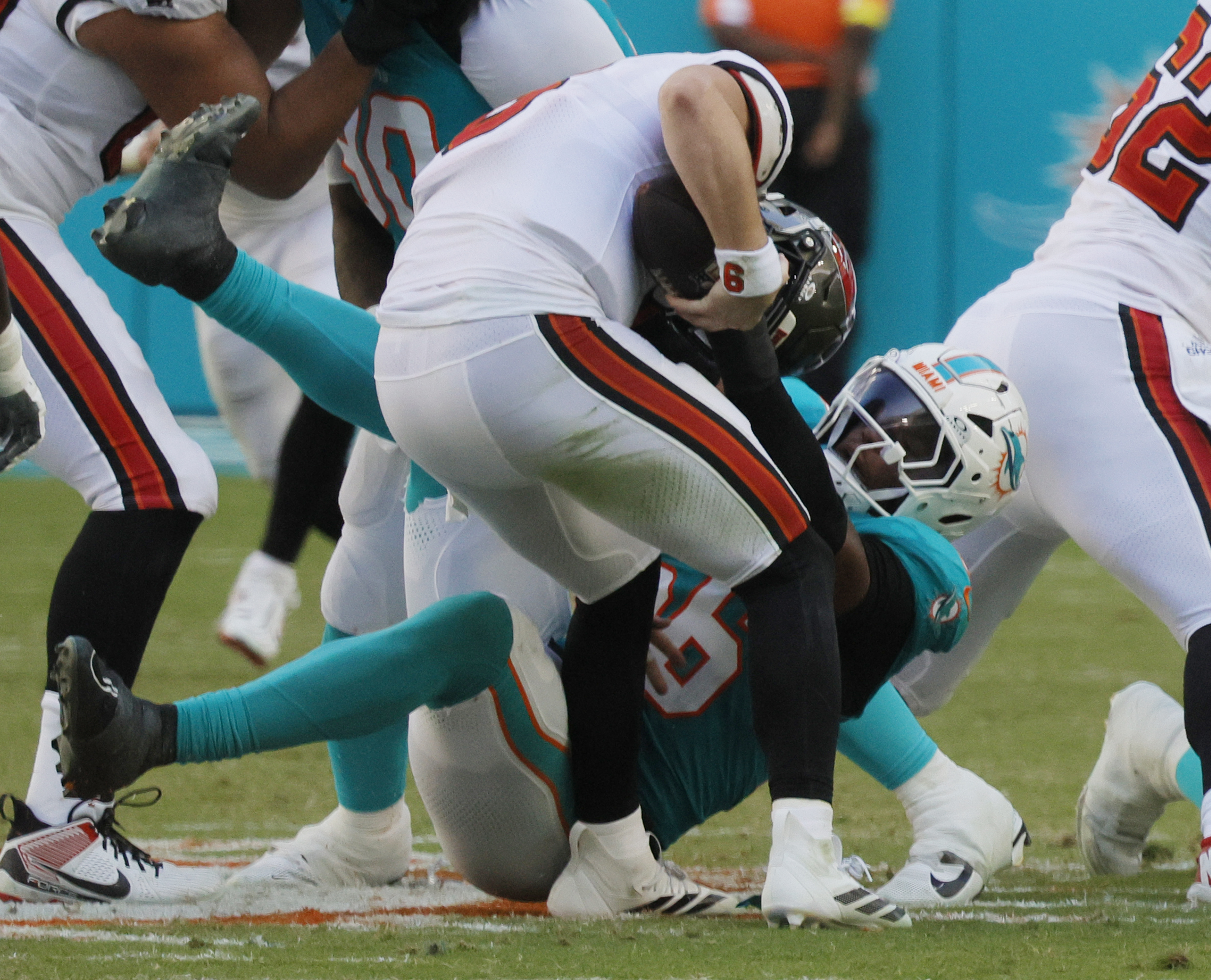 Miami Dolphins linebacker Quinton Bell (56) pursues Tampa Bay Buccaneers...