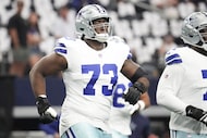 Dallas Cowboys guard Tyler Smith (73) warms up before an NFL football game against the New...
