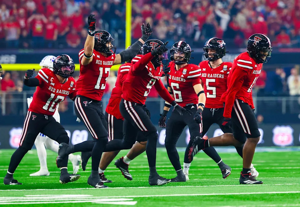Dec 6, 2025; Arlington, TX, USA; Texas Tech Red Raiders linebacker Ben Roberts (13) celebrates with teammates after making an interception during the second half against the BYU Cougars at AT&T Stadium. Mandatory Credit: Kevin Jairaj-Imagn Images