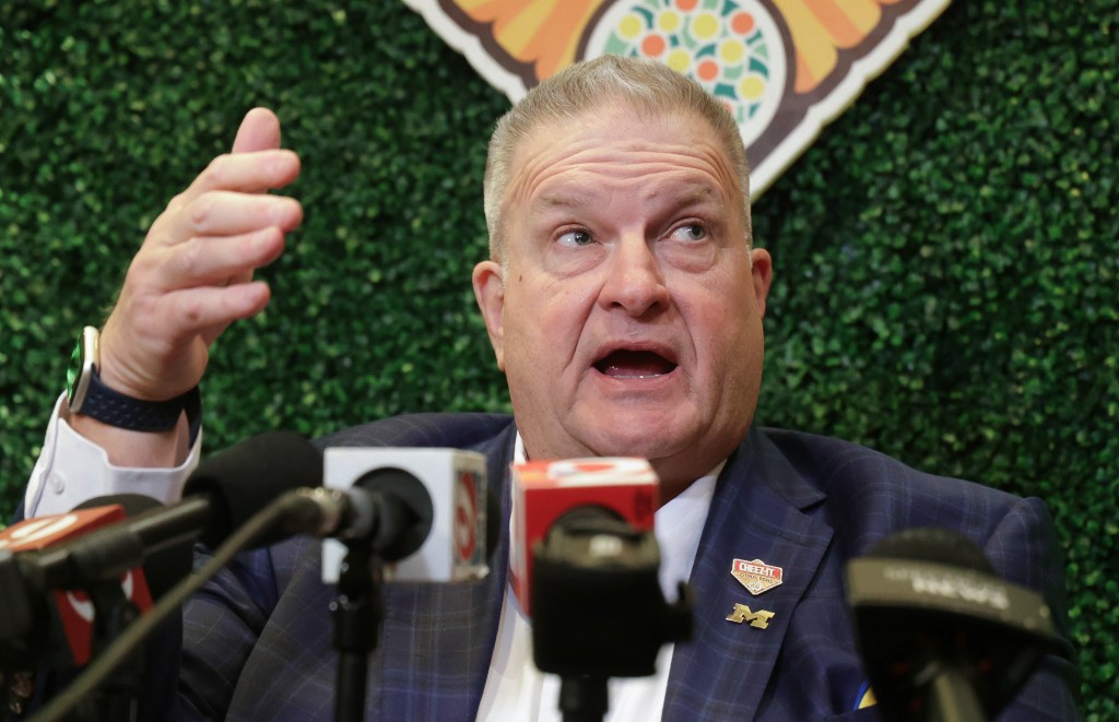 Michigan interim head coach Biff Poggi answers a question during an NCAA college football Citrus Bowl news conference in Winter Park, Fla., Monday, Dec. 15, 2025.