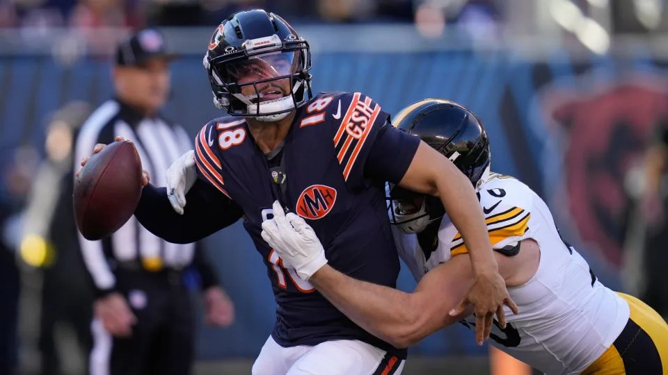Bears quarterback Caleb Williams tries to shake off Pittsburgh's TJ Watt during a game last month. - Erin Hooley/AP