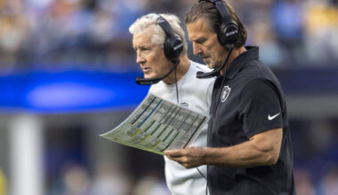 Raiders interim offensive coordinator Greg Olson, right, draws up a play while Raiders head coa ...