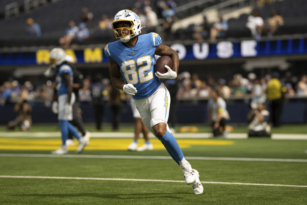 Los Angeles Chargers wide receiver Brenden Rice (82) runs with the ball before an NFL preseason ...