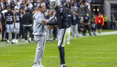 Raiders head coach Pete Carroll consoles quarterback Geno Smith (7) as they need a late score i ...