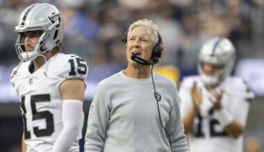 Raiders head coach Pete Carroll reacts to a penalty with quarterback Kenny Pickett (15) walking ...