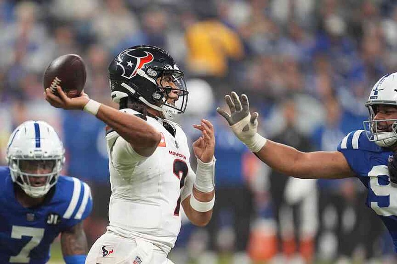 Houston Texans quarterback C.J. Stroud (7) throws a pass against the Indianapolis Colts during the second half of an NFL football game Sunday, Nov. 30, 2025, in Indianapolis. (AP Photo/Michael Conroy)