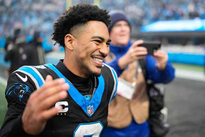 Carolina Panthers quarterback Bryce Young celebrates after an NFL football game between the Carolina Panthers and the Los Angeles Rams, Sunday, Nov. 30, 2025, in Charlotte, N.C. (AP Photo/Jacob Kupferman)