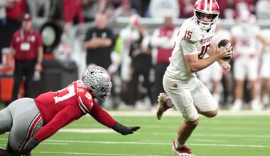 Indiana's Fernando Mendoza scrambles pasr Ohio State's Kenyatta Jackson Jr. during th ...