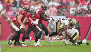 Tampa Bay Buccaneers quarterback Baker Mayfield (6) spins out tackle attempts during an NFL foo ...