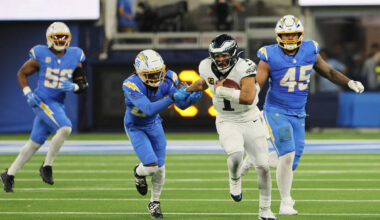 Philadelphia Eagles quarterback Jalen Hurts (1) runs during overtime of an NFL football game ag ...