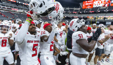 New Mexico Lobos players celebrate their win over UNLV 40-35 with the fans following the second ...