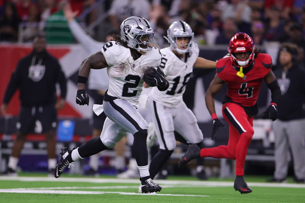 Ashton Jeanty #2 of the Las Vegas Raiders runs for a fourth quarter touchdown against the Houston Texans at NRG Stadium on December 21, 2025 in Houston, Texas. 