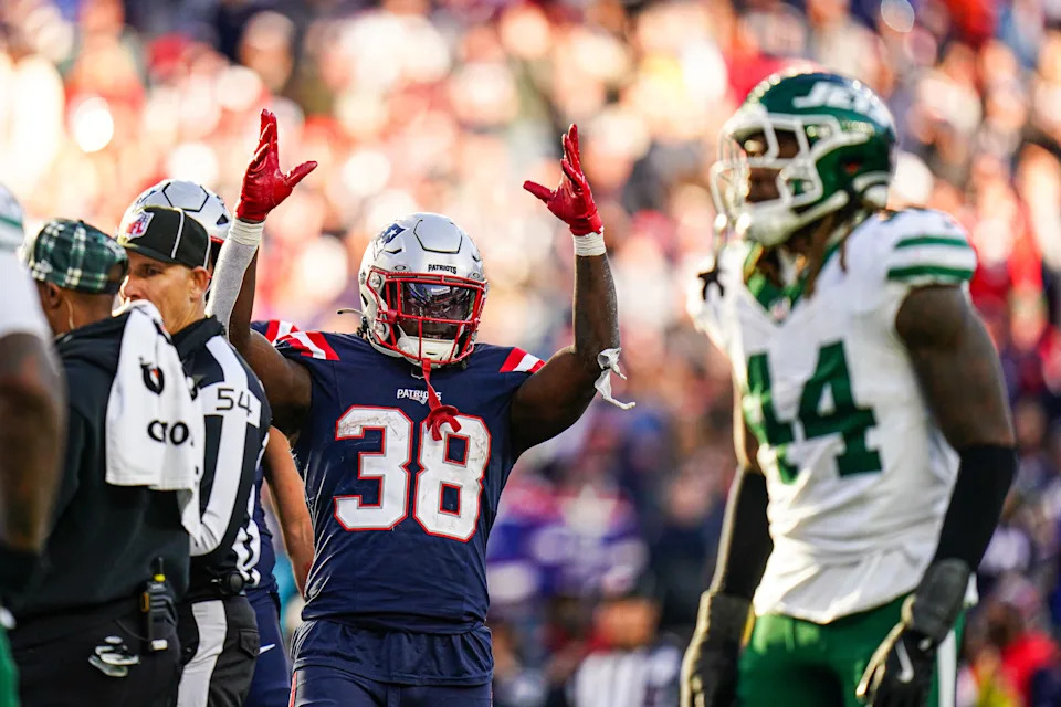 Oct 27, 2024; Foxborough, Massachusetts, USA; New England Patriots running back Rhamondre Stevenson (38) reacts after his touchdown is confirmed against the New York Jets in the second half at Gillette Stadium. Mandatory Credit: David Butler II-Imagn Images