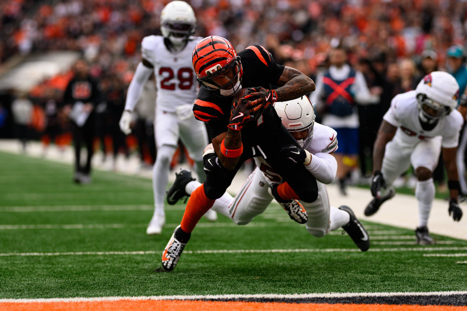 Bengals receiver Ja'Marr Chase reaches out to score a touchdown in the first quarter of their game against the Arizona Cardinals on Sunday, Dec. 28 at Paycor Stadium. JEREMY MILLER / CONTRIBUTED PHOTO