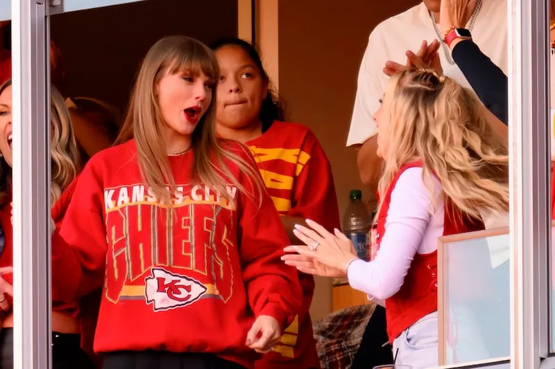 Taylor Swift, left, and Brittany Mahomes react to a Travis Kelce touchdown against the Los Angeles Chargers during the first half of an NFL football game, Sunday, Oct. 22, 2023 in Kansas City, Mo. ( | Reed Hoffmann