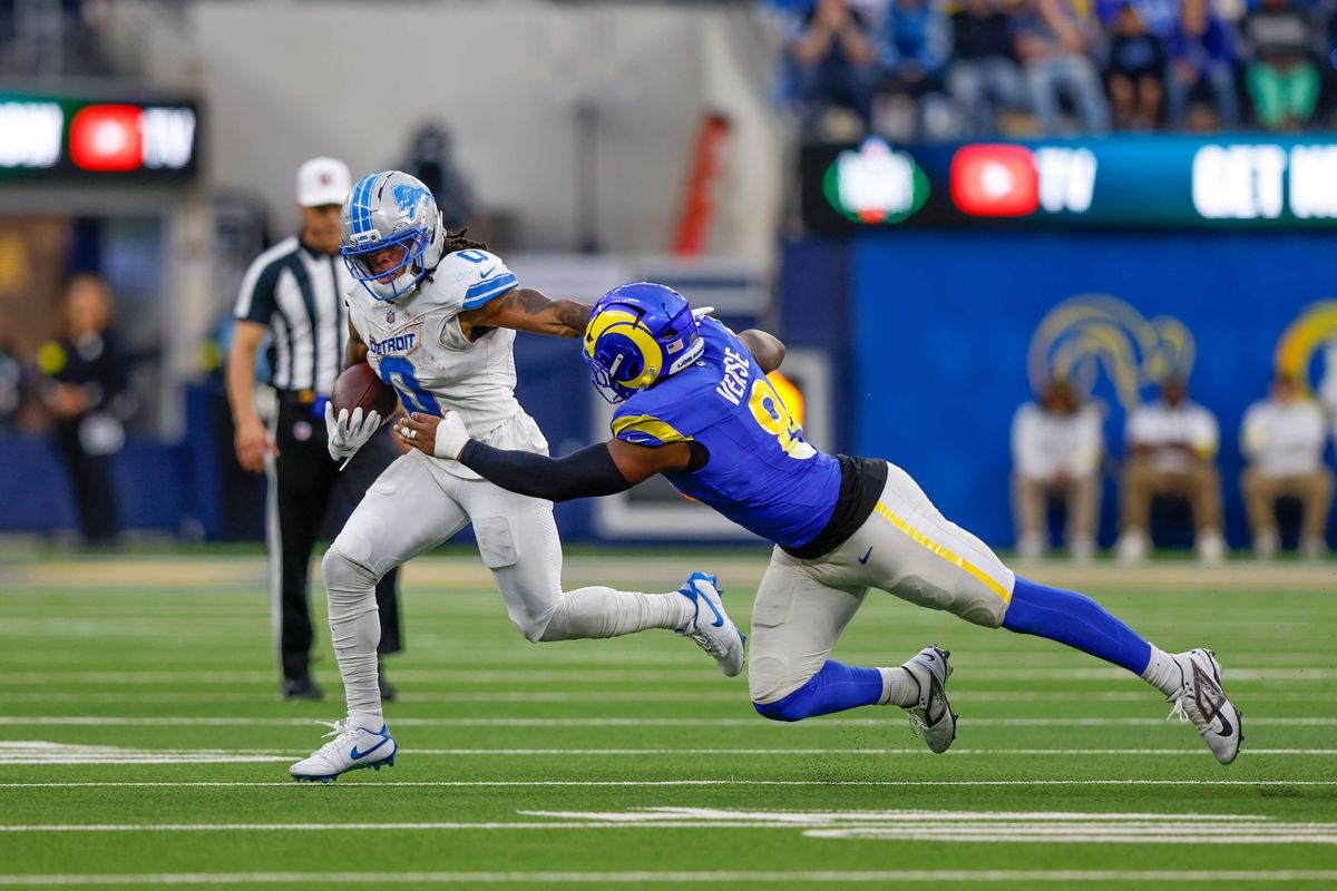 Detroit Lions running back Jahmyr Gibbs (0) runs the ball and get tackled by Los Angeles Rams linebacker Jared Verse (8) during a NFL game against the Detroit Lions on December 15, 2025 at Sofi Stadium in Inglewood, CA.