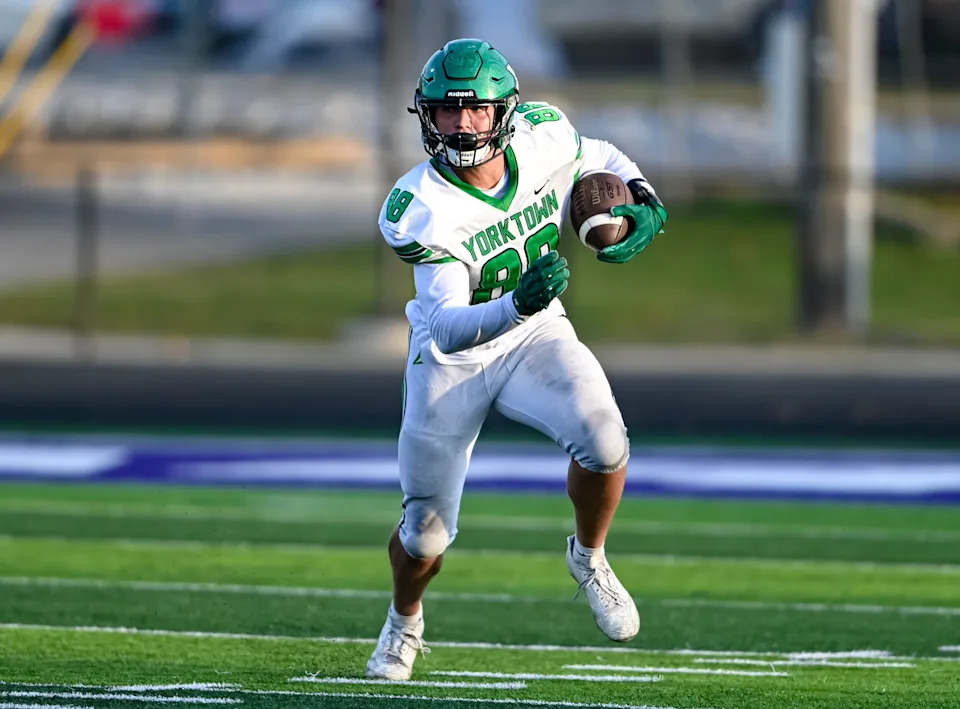 Yorktown senior Jabin Barnes runs with the ball after a catch during an IHSAA high school football game against Muncie Central Friday, Aug. 29, 2025, at Muncie Central High School.