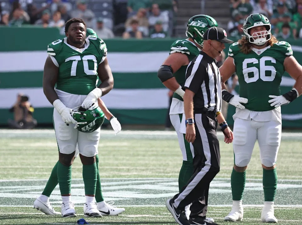 New York Jets players Armand Membou (70) and Josh Myers (66) on react on the field with a referee. Robert Sabo for NY Post