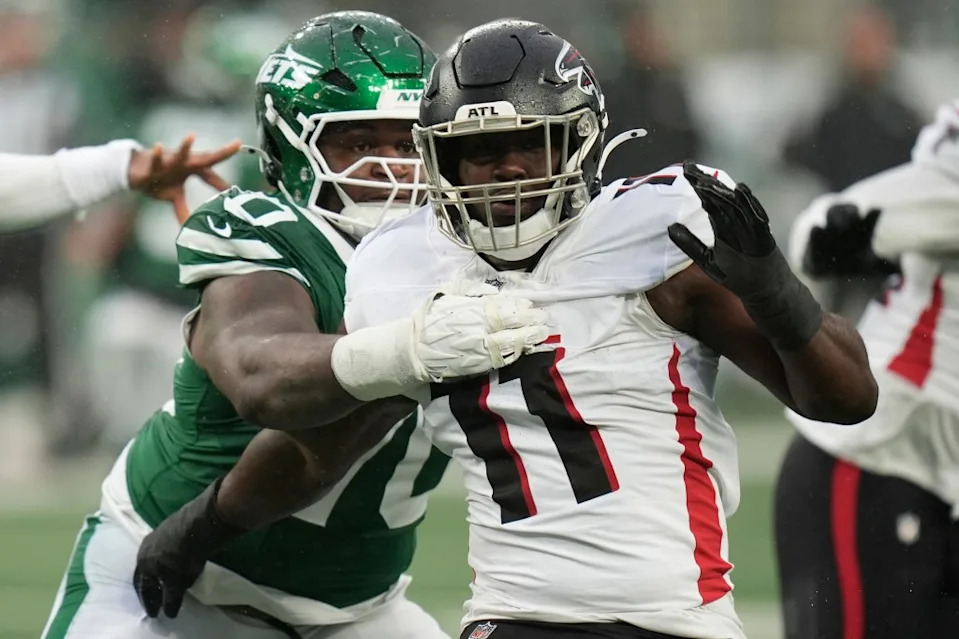 Jets offensive tackle Armand Membou (70) and Atlanta Falcons linebacker Jalon Walker (11) collide during the first half of an NFL football game, Sunday, Nov. 30, 2025, in East Rutherford, N.J AP