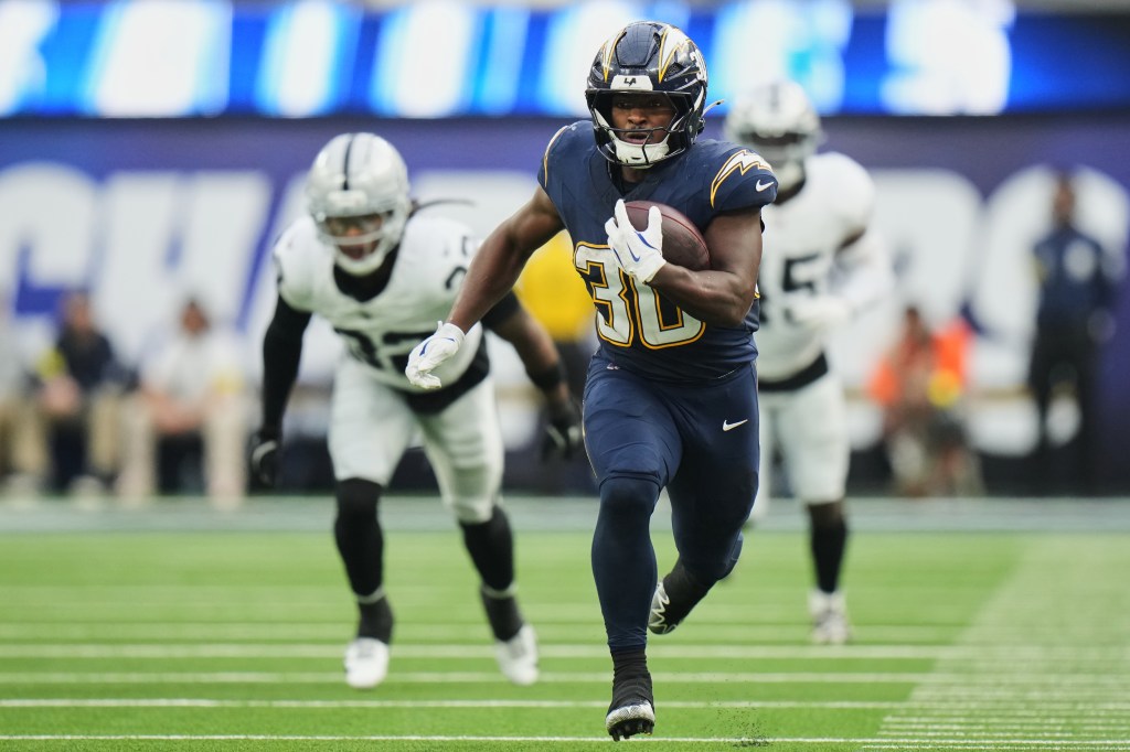 Los Angeles Chargers running back Kimani Vidal (30) runs for a touchdown.