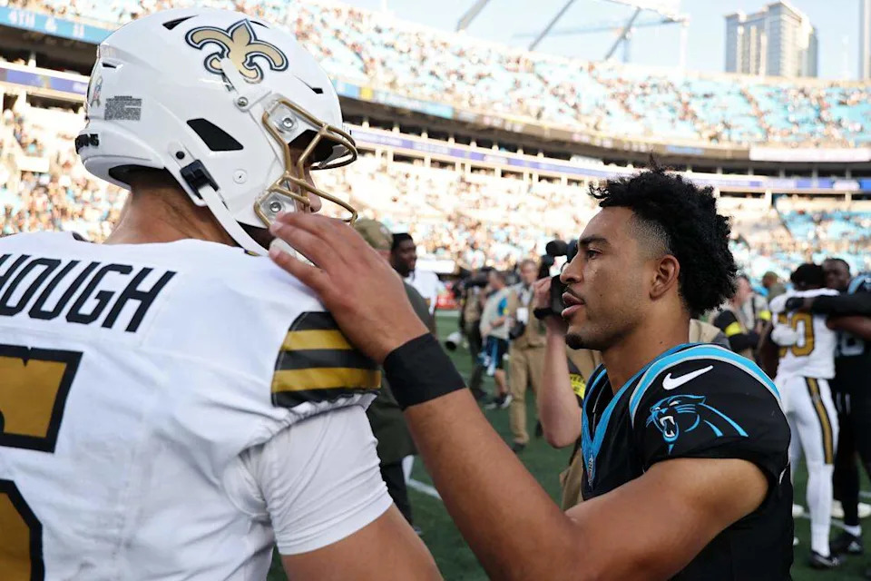 New Orleans QB Tyler Shough (left) and Carolina QB Bryce Young talk after their Nov. 9, 2025 game, when Shough led the Saints to a 17-7 win in Charlotte.