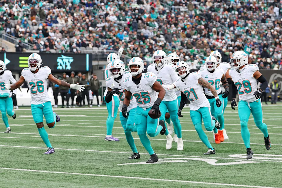 Dec 7, 2025; East Rutherford, New Jersey, USA; Miami Dolphins linebacker Tyrel Dodson (25) celebrates after making an interception against the New York Jets during the first half at MetLife Stadium. Mandatory Credit: Ed Mulholland-Imagn Images