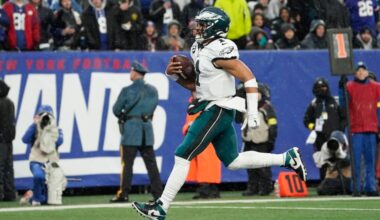 Philadelphia Eagles quarterback Jalen Hurts (1) scores a touchdown against the New York Giants during the third quarter of an NFL football game, Sunday, Dec. 11, 2022, in East Rutherford, N.J.