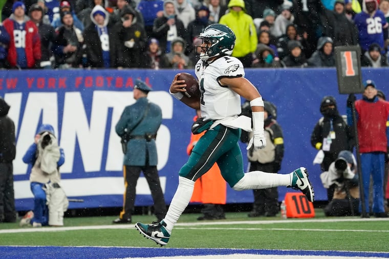 Philadelphia Eagles quarterback Jalen Hurts (1) scores a touchdown against the New York Giants during the third quarter of an NFL football game, Sunday, Dec. 11, 2022, in East Rutherford, N.J.