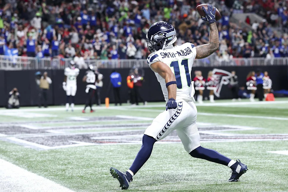 Jaxon Smith-Njigba (11) of the Seattle Seahawks celebrates after scoring a third quarter touchdown against the Atlanta Falcons at Mercedes-Benz Stadium on Dec. 7, 2025 in Atlanta.