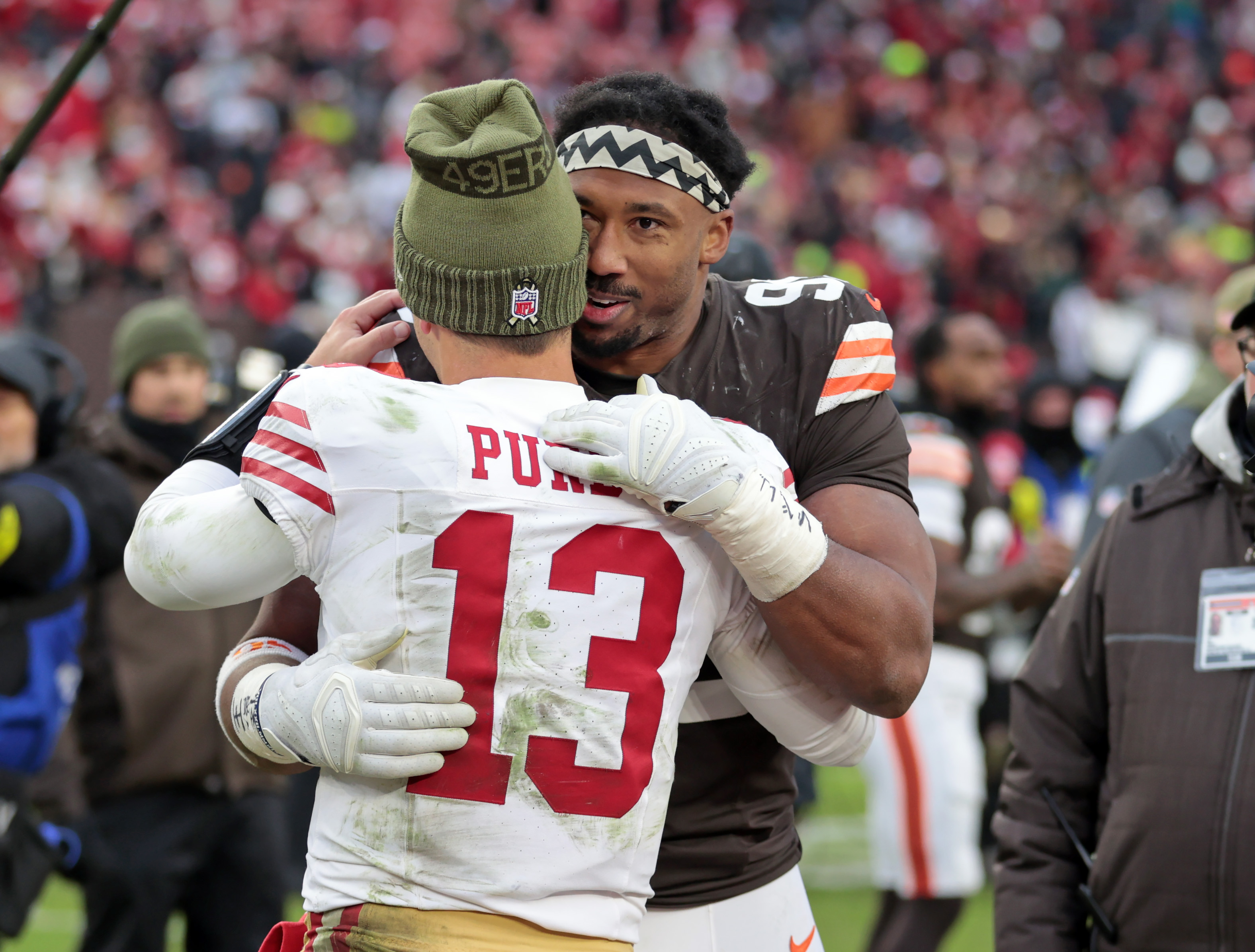 Cleveland Browns defensive end Myles Garrett hugs San Francisco 49ers quarterback Brock Purdy after the game. 