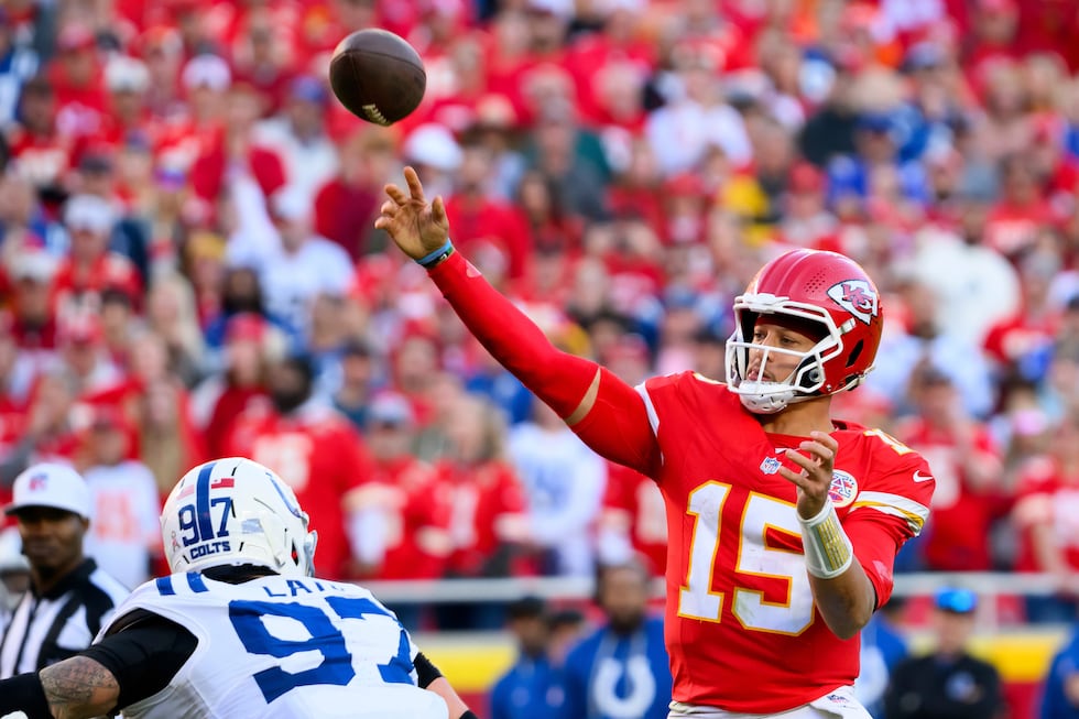 Kansas City Chiefs quarterback Patrick Mahomes (15) throws while being pressured by...