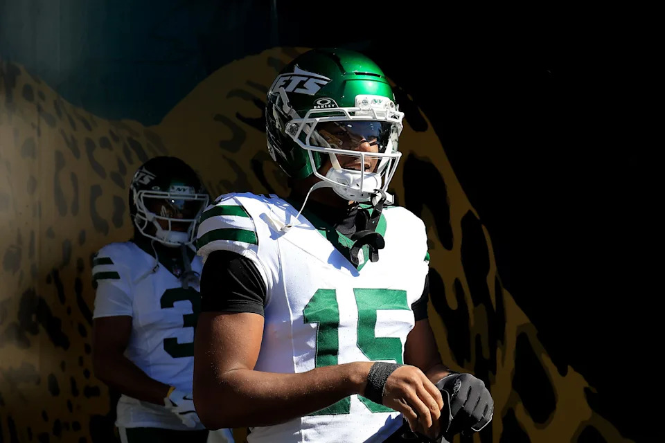 JACKSONVILLE, FLORIDA - DECEMBER 14: Adonai Mitchell #15 of the New York Jets walks onto the field for warmups before the game against the Jacksonville Jaguars at EverBank Stadium on December 14, 2025 in Jacksonville, Florida. (Photo by Mike Carlson/Getty Images)