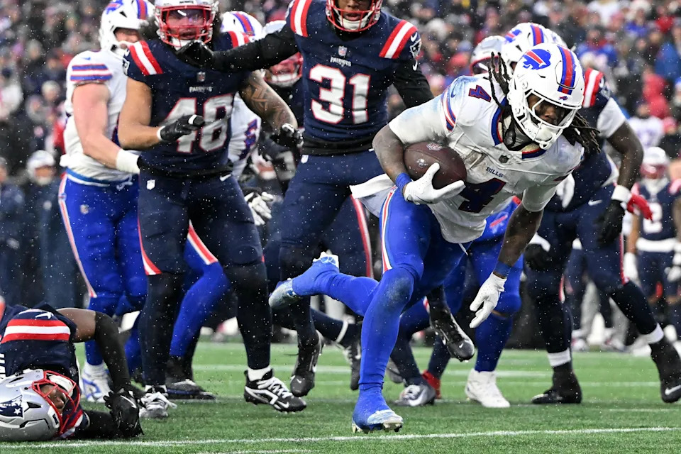 Dec 14, 2025; Foxborough, Massachusetts, USA; Buffalo Bills running back James Cook III (4) runs for a touchdown against the New England Patriots during the second half at Gillette Stadium. Mandatory Credit: Brian Fluharty-Imagn Images