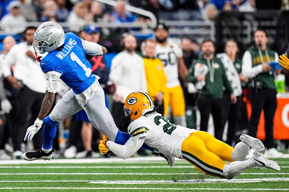 Detroit Lions wide receiver Jameson Williams makes a catch against Green Bay Packers safety Xavier McKinney.