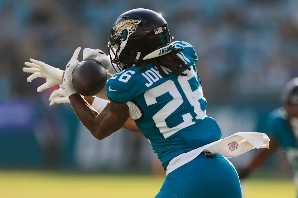 Jacksonville Jaguars safety Antonio Johnson (26) effectively ends the game on an interception against New York Jets wide receiver Arian Smith (82) during the fourth quarter of an NFL football matchup at EverBank Stadium, Sunday, Dec. 14, 2025, in Jacksonville, Fla. The Jaguars defeated the Jets 48-20. [Corey Perrine/Florida Times-Union]