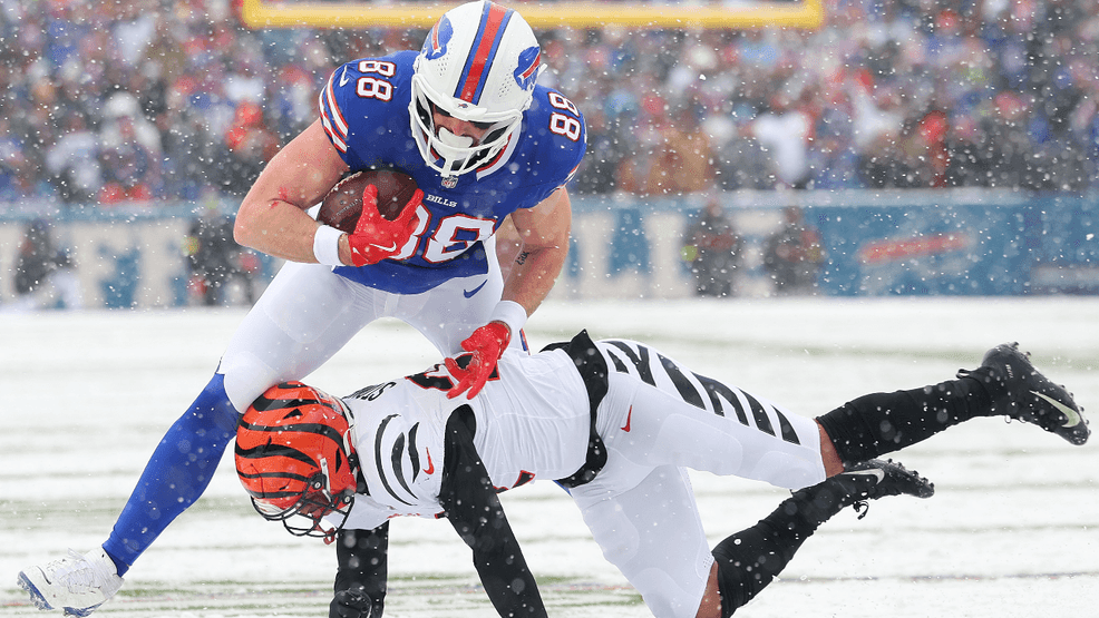 Dawson Knox #88 of the Buffalo Bills is tackled by Geno Stone #22 of the Cincinnati Bengals during the second quarter at Highmark Stadium on December 07, 2025 in Orchard Park, New York. (Photo by Timothy T Ludwig/Getty Images)