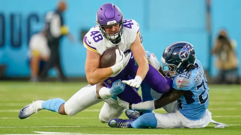 Tennessee Titans linebacker Cedric Gray (51) and cornerback Jarvis Brownlee Jr. (29) tackle Minnesota Vikings tight end Ben Yurosek (48) during the 1st quarter of an NFL pre-season game at Nissan Stadium in Nashville, Tenn., Friday, Aug. 22, 2025. © Andrew Nelles / The Tennessean / USA TODAY NETWORK via Imagn Images.