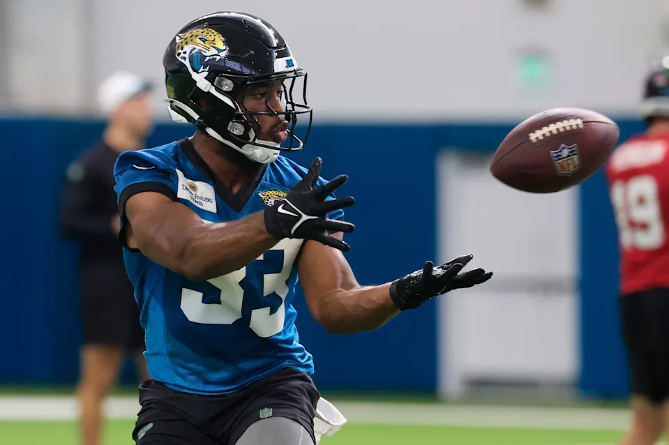 Jacksonville Jaguars running back Bhayshul Tuten (33) catches a pass during the 10th organized team activity at Miller Electric Center Wednesday, June 4, 2025 in Jacksonville, Fla. [Corey Perrine/Florida Times-Union]