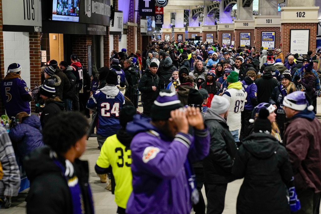 A large crowd of fans moves through the concourse to find their seats ahead of a football game between the Baltimore Ravens and the New England Patriots at M&T Bank Stadium in Baltimore, Md. on Sunday, December 21, 2025. The Sunday Night Football game was the Ravens’ final home game of the regular season.