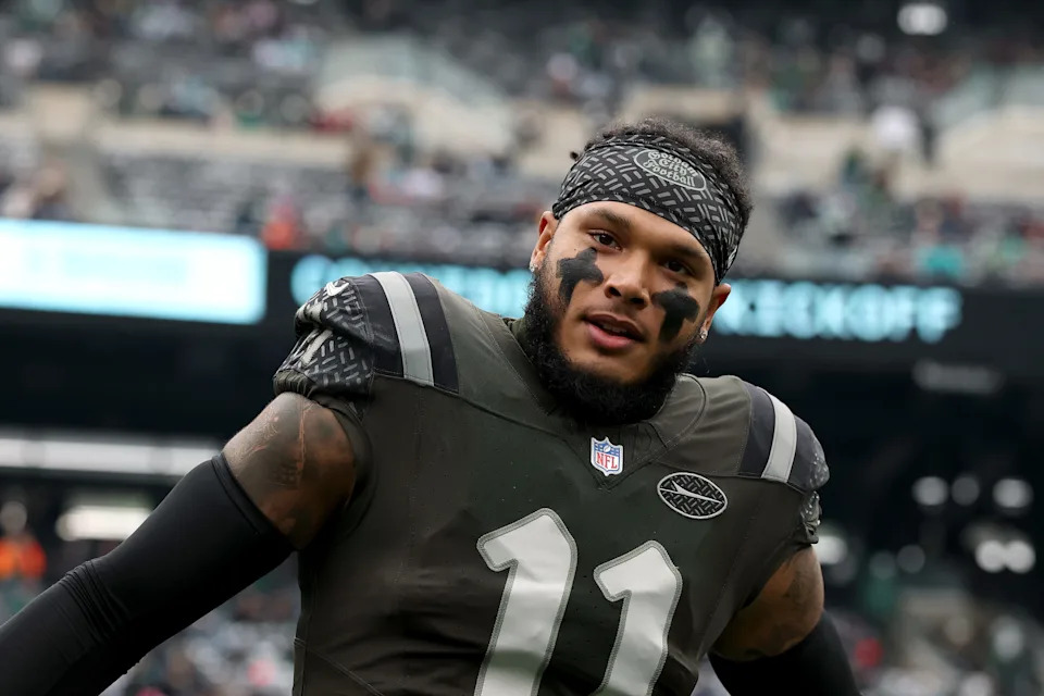 EAST RUTHERFORD, NEW JERSEY - DECEMBER 07: Jermaine Johnson #11 of the New York Jets runs onto the field prior to the NFL 2025 game against the Miami Dolphins at MetLife Stadium on December 07, 2025 in East Rutherford, New Jersey."" (Photo by Kenneth Richmond/Getty Images)