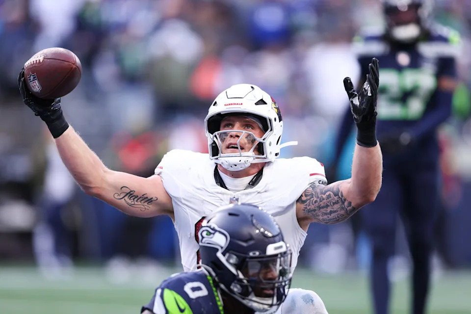 Arizona Cardinals tight end Trey McBride celebrates after scoring a touchdown.