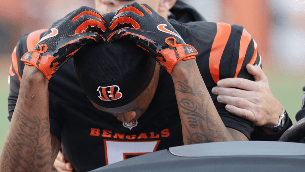 Tee Higgins #5 of the Cincinnati Bengals is helped off the field during the fourth quarter of a game against the New England Patriots at Paycor Stadium on November 23, 2025 in Cincinnati, Ohio. (Photo by Michael Hickey/Getty Images)