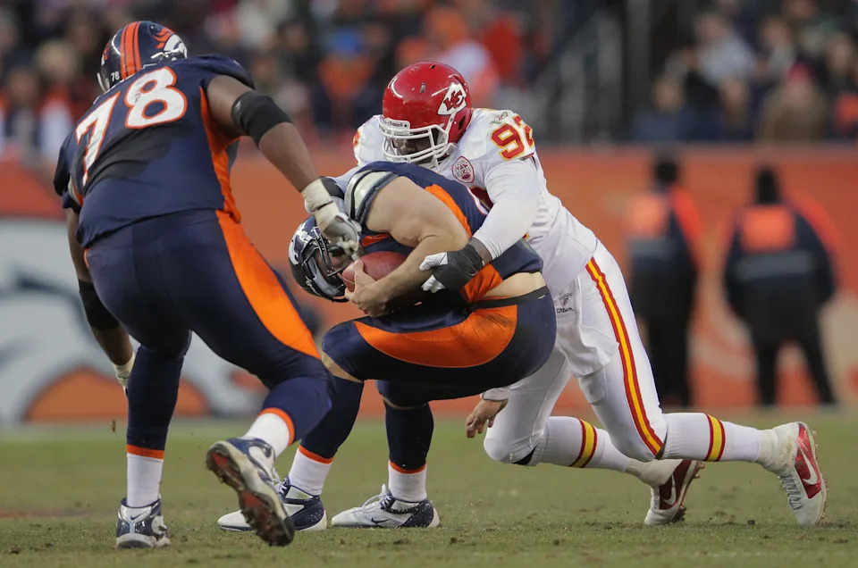 DENVER, CO - JANUARY 01: Wallace Gilberry #92 of the Kansas City Chiefs sacks quarterback Tim Tebow #15 of the Denver Broncos at Sports Authority Field at Mile High on January 1, 2012 in Denver, Colorado. The Chiefs defeated the Broncos 7-3. (Photo by Doug Pensinger/Getty Images)
