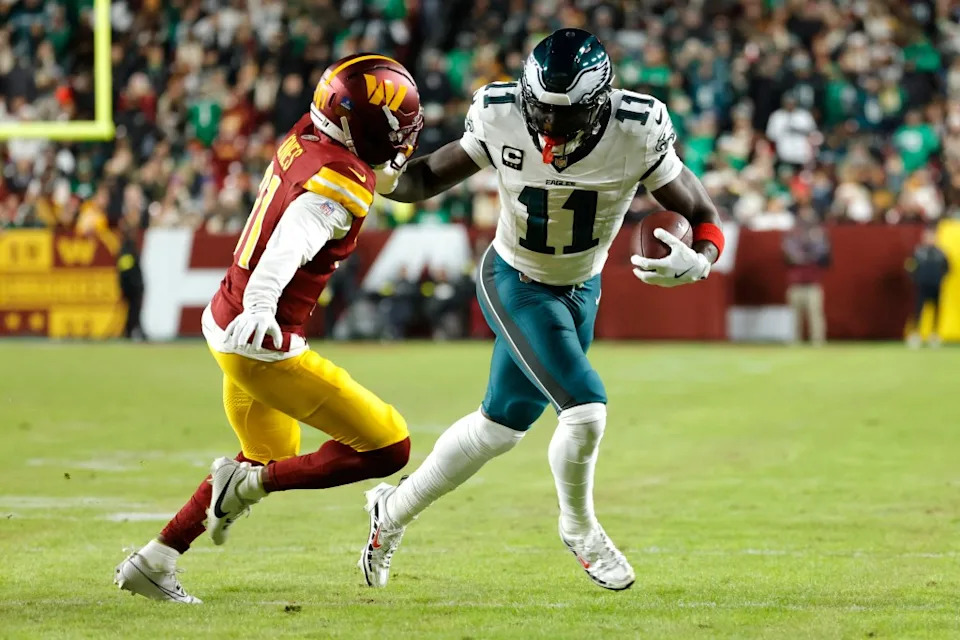 Philadelphia Eagles wide receiver A.J. Brown (11) runs against Washington Commanders cornerback Jonathan Jones (31) during the first half at Northwest Stadium. IMAGN IMAGES via Reuters Connect