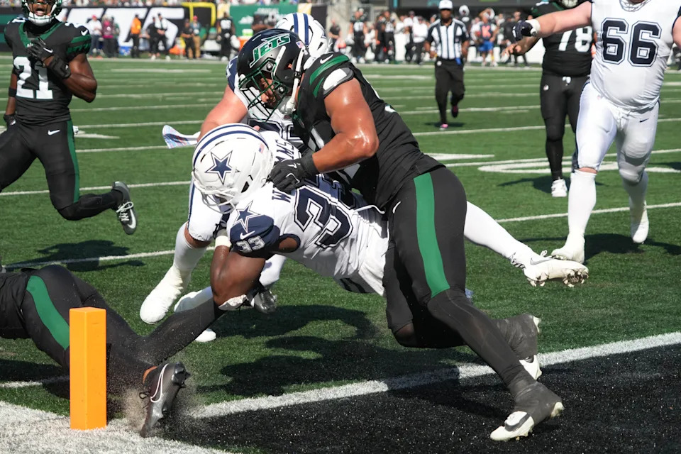 Dallas Cowboys running back Javonte Williams scores a touchdown.