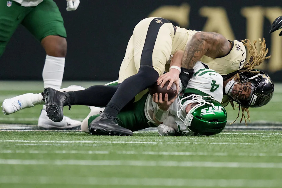Dec 21, 2025; New Orleans, Louisiana, USA; New Orleans Saints defensive end Chase Young (99) sacks New York Jets quarterback Brady Cook (4) on 4th down causing a turnover on downs during the fourth quarter at Caesars Superdome. Mandatory Credit: Matthew Hinton-Imagn Images