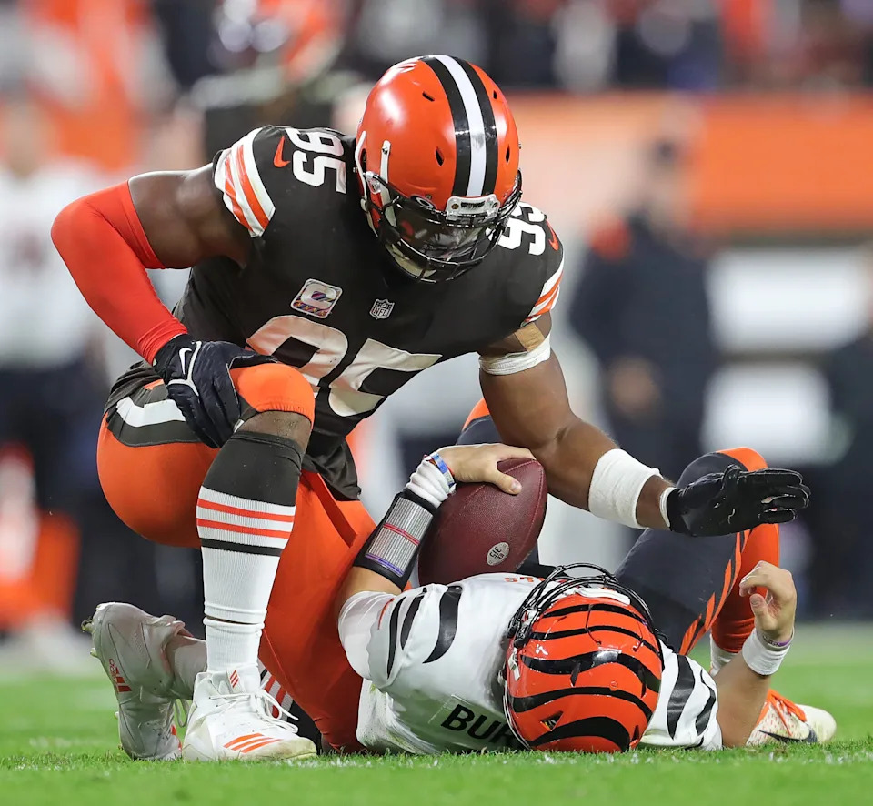 Cleveland Browns defensive end Myles Garrett pats Cincinnati Bengals quarterback Joe Burrow after sacking him.